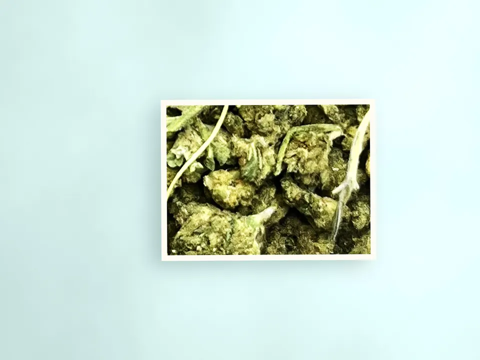 Mixed smalls THCA flower on a painted plank